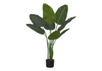 Artificial Bird of Paradise plant with large, wide green leaves in a simple black pot against a white background.