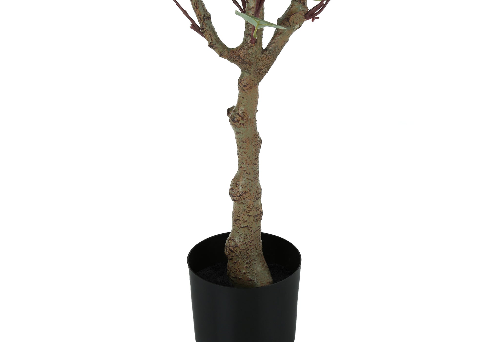 Close-up of the textured brown trunk of an artificial eucalyptus tree standing in a simple black pot.