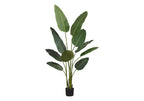 Large faux Bird of Paradise plant with broad green leaves in a black nursery pot
