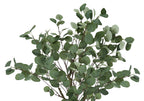 Close-up of the lush green foliage and thin brown branches of an artificial eucalyptus tree against a white background.