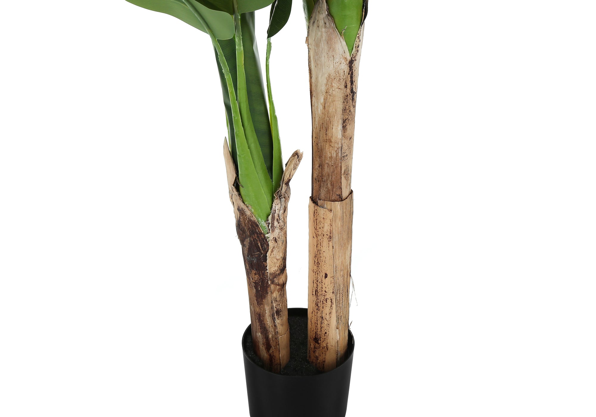 Close-up of the dual textured brown trunks and green leaves of an artificial banana plant in a black pot.