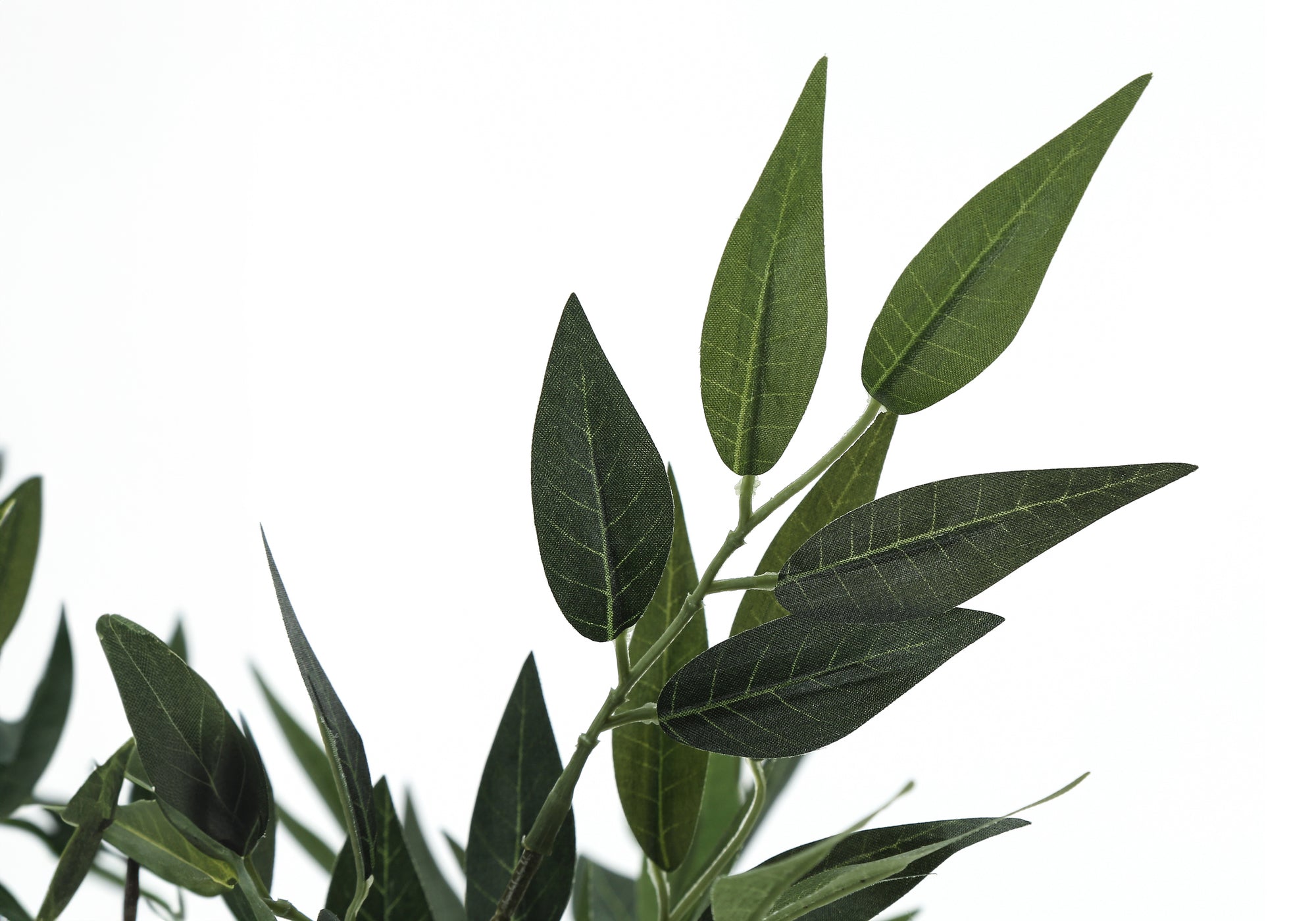 Close-up of realistic green leaves on the faux acacia tree