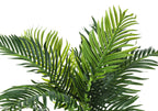 Close-up of the vibrant green, feathery fronds of an artificial Large Cat Palm plant against a white background.