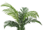 Close-up of the lush, feathered green fronds of an artificial Majesty Palm tree against a white background.