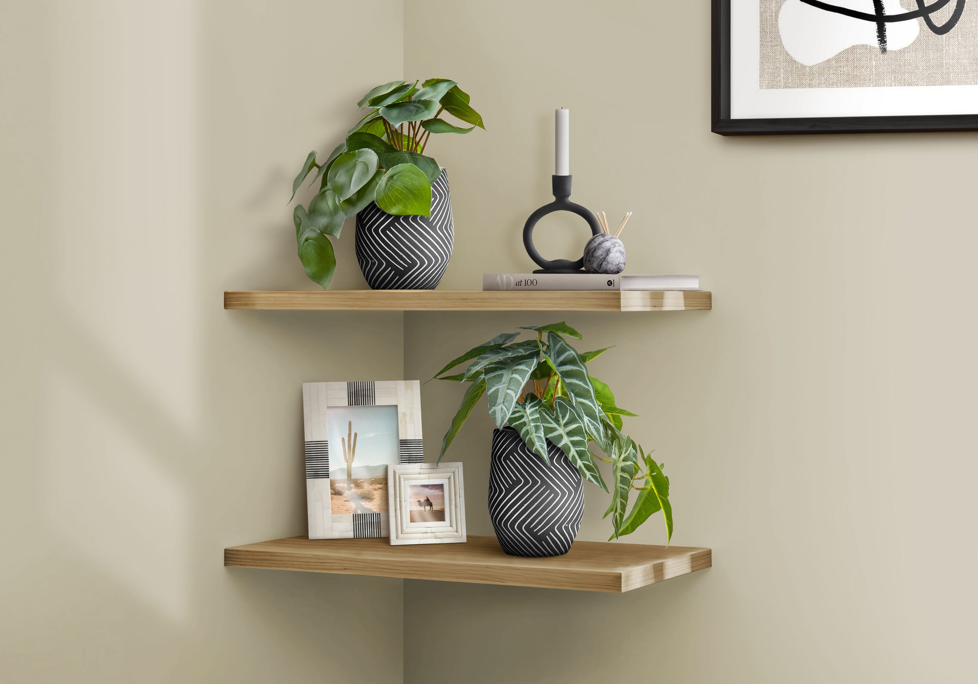 Two artificial plants in patterned black and white pots styled on wooden corner shelves with decor items.