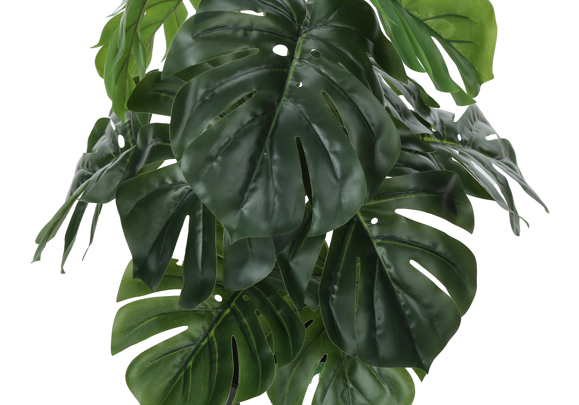 Close-up of the large, split green leaves of an artificial Monstera plant against a white background.