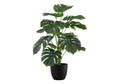 Artificial Medium Monstera plant with large, split green leaves in a black pot against a white background.