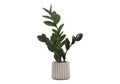 An artificial small ZZ plant with glossy green leaves in a ribbed grey pot against a white background.