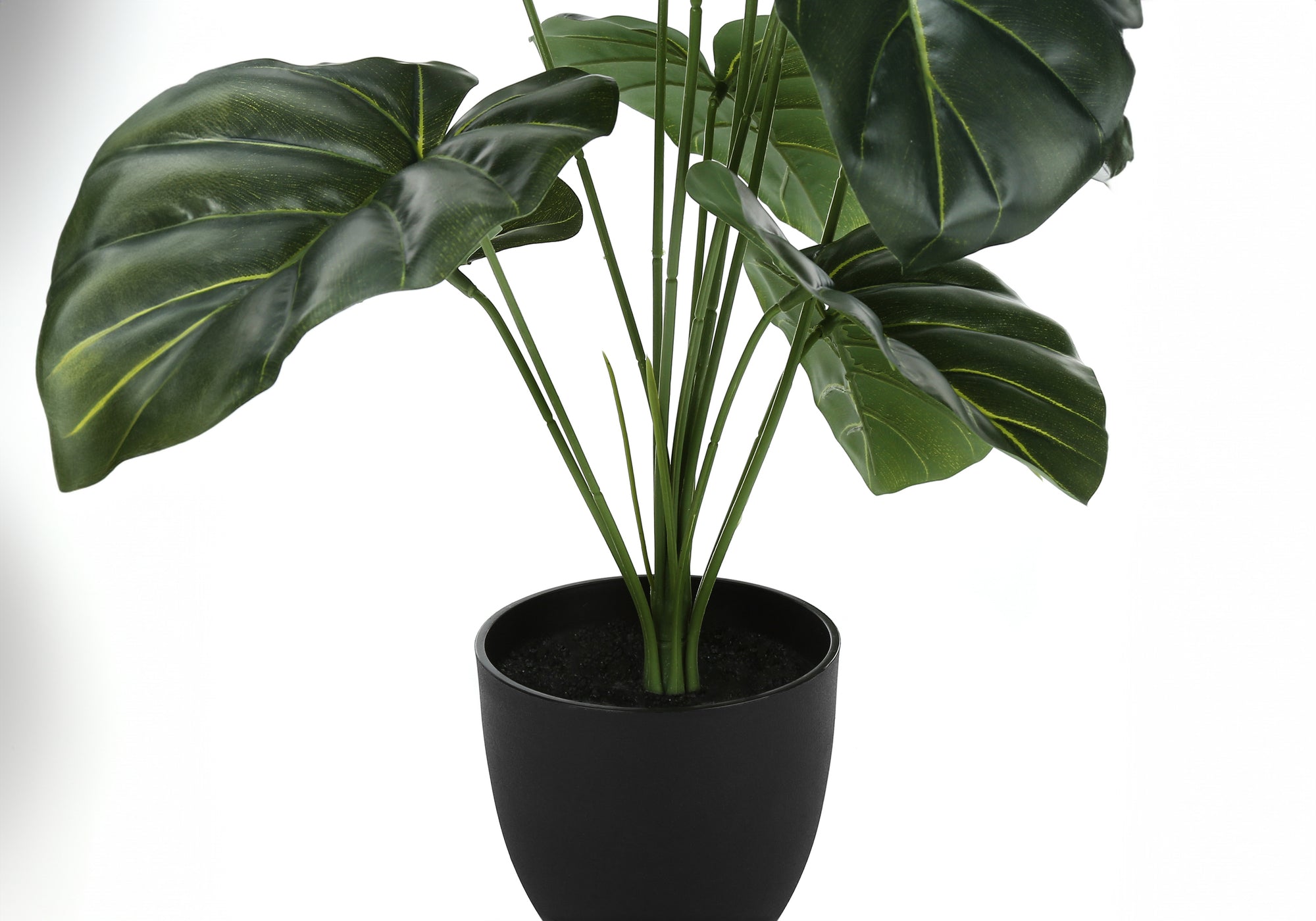 An artificial Medium Alocasia plant with large, textured green leaves in a simple black pot.