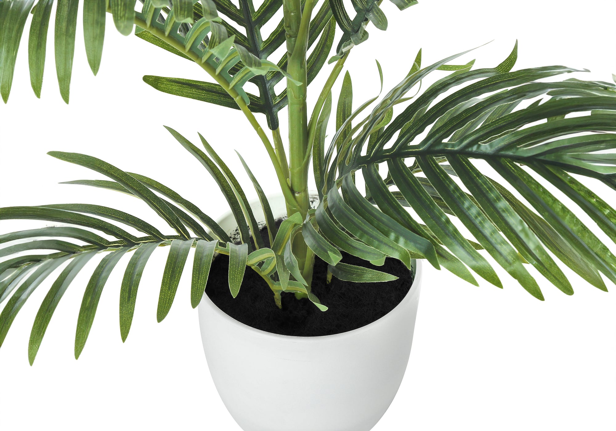 Close-up of a medium artificial Areca palm tree with green fronds planted in a simple white pot against white.